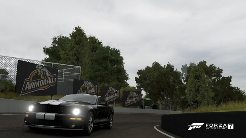 Black Muscle Car on Track — Overcast