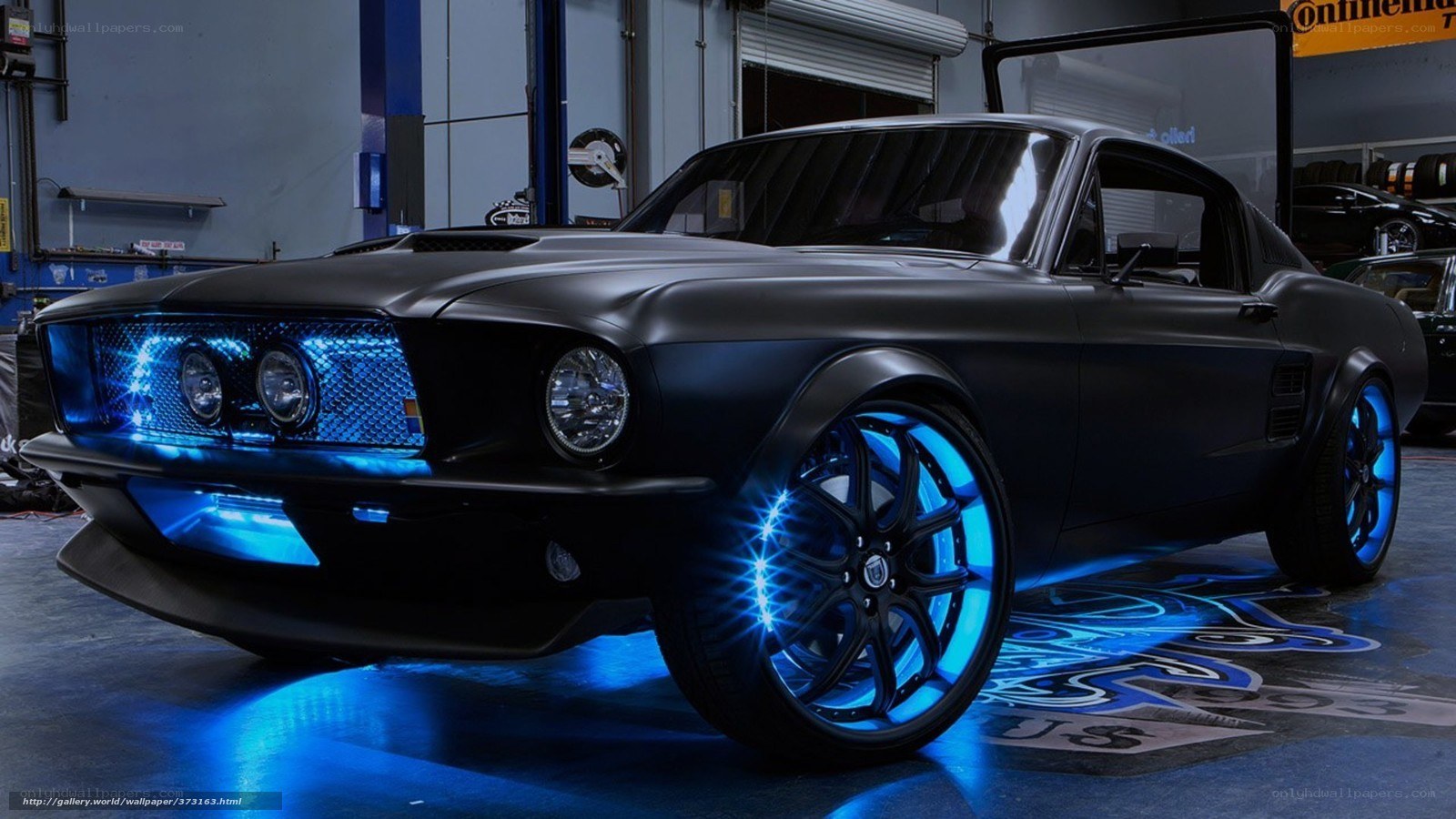 black muscle car with blue lights
