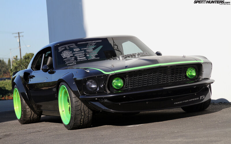 black muscle car with green accents