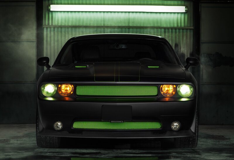 black muscle car with green lights