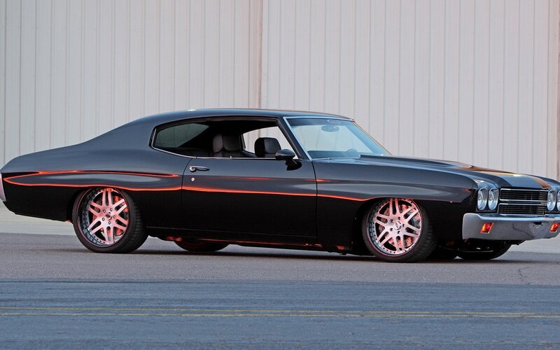 black muscle car with red accents