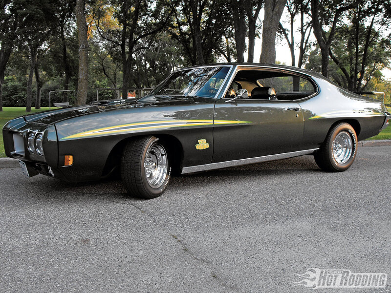 Black muscle car with stripes