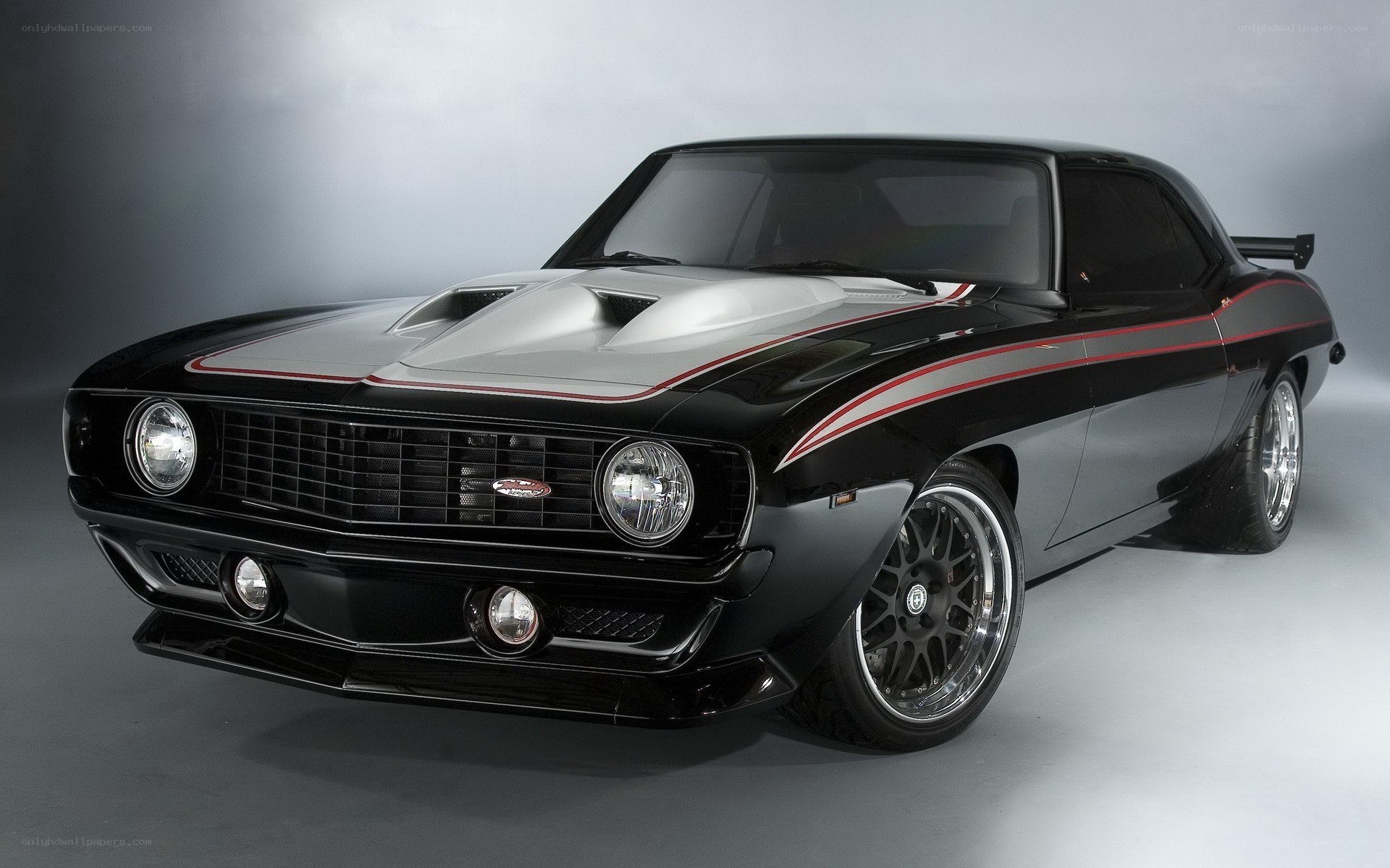 Black muscle car with stripes