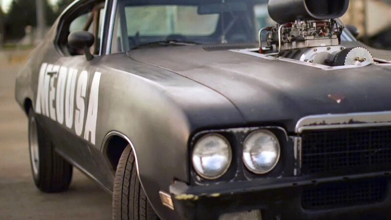 black muscle car with supercharger