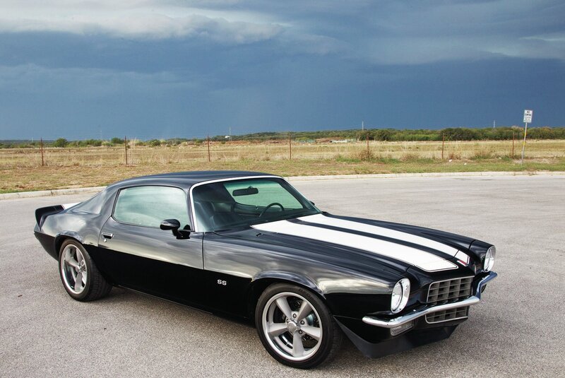 Black muscle car with white stripes