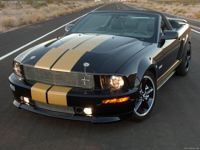 black mustang convertible on road