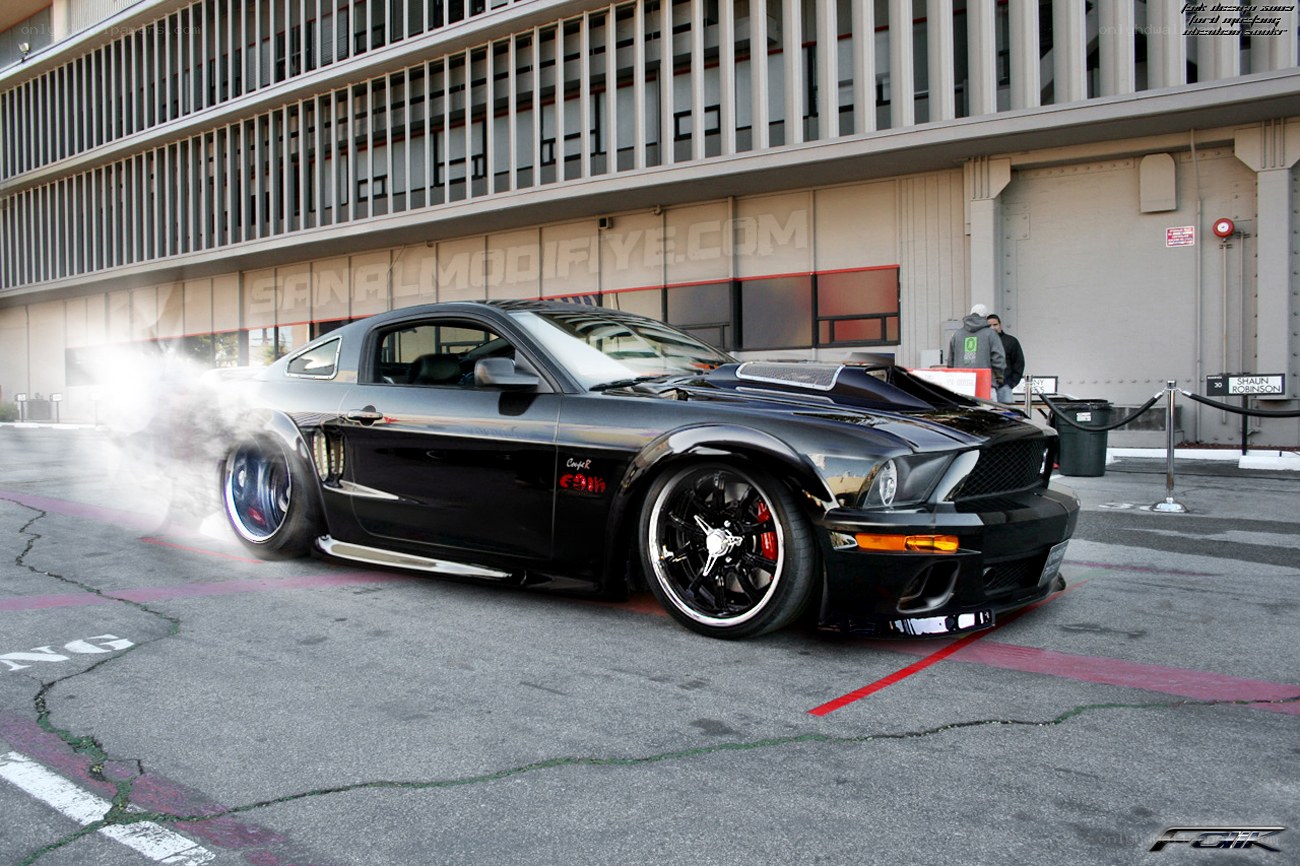 black mustang doing burnout