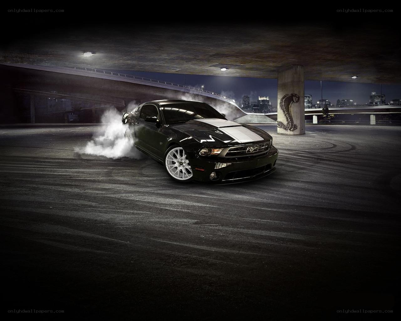 Black Mustang drifting at night
