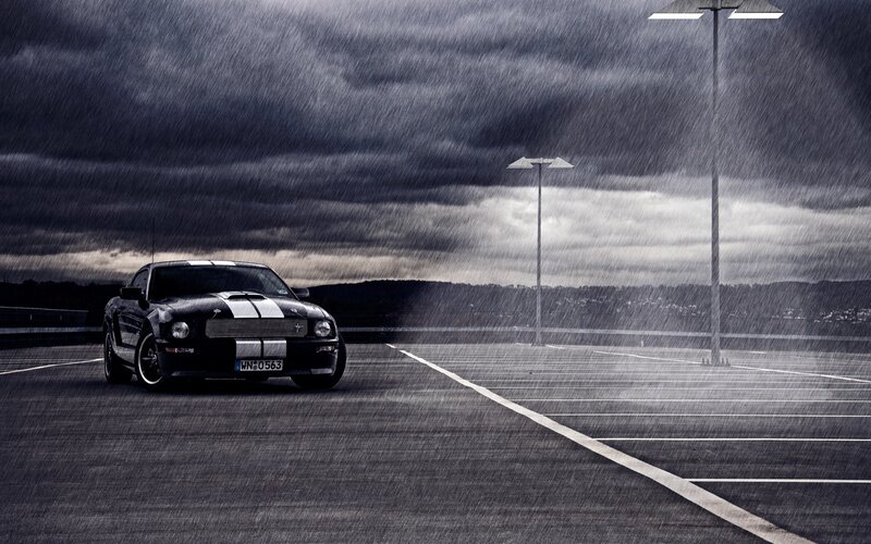 Black Mustang in Rainy Parking Lot