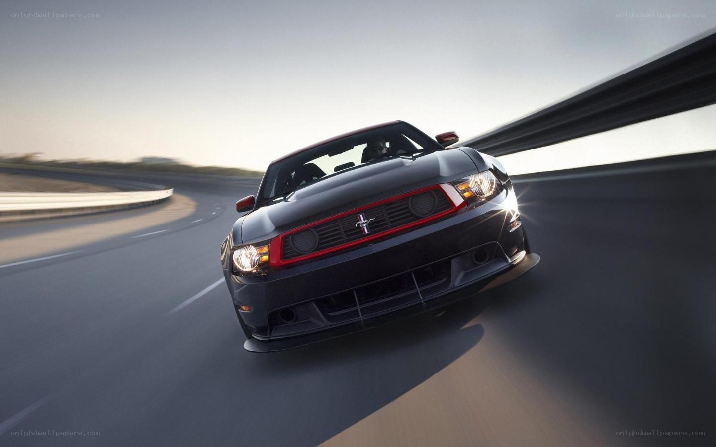 black mustang on a racetrack