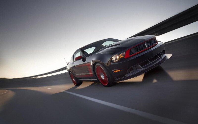 black mustang on a road