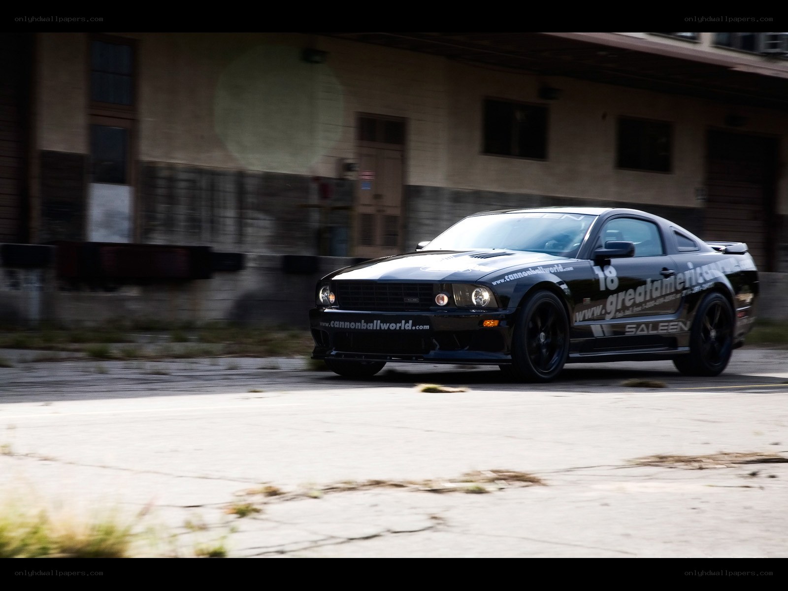 black mustang on a track