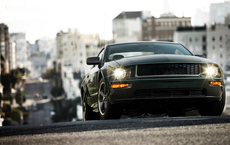 black mustang on city street