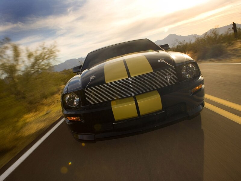 black mustang on desert road