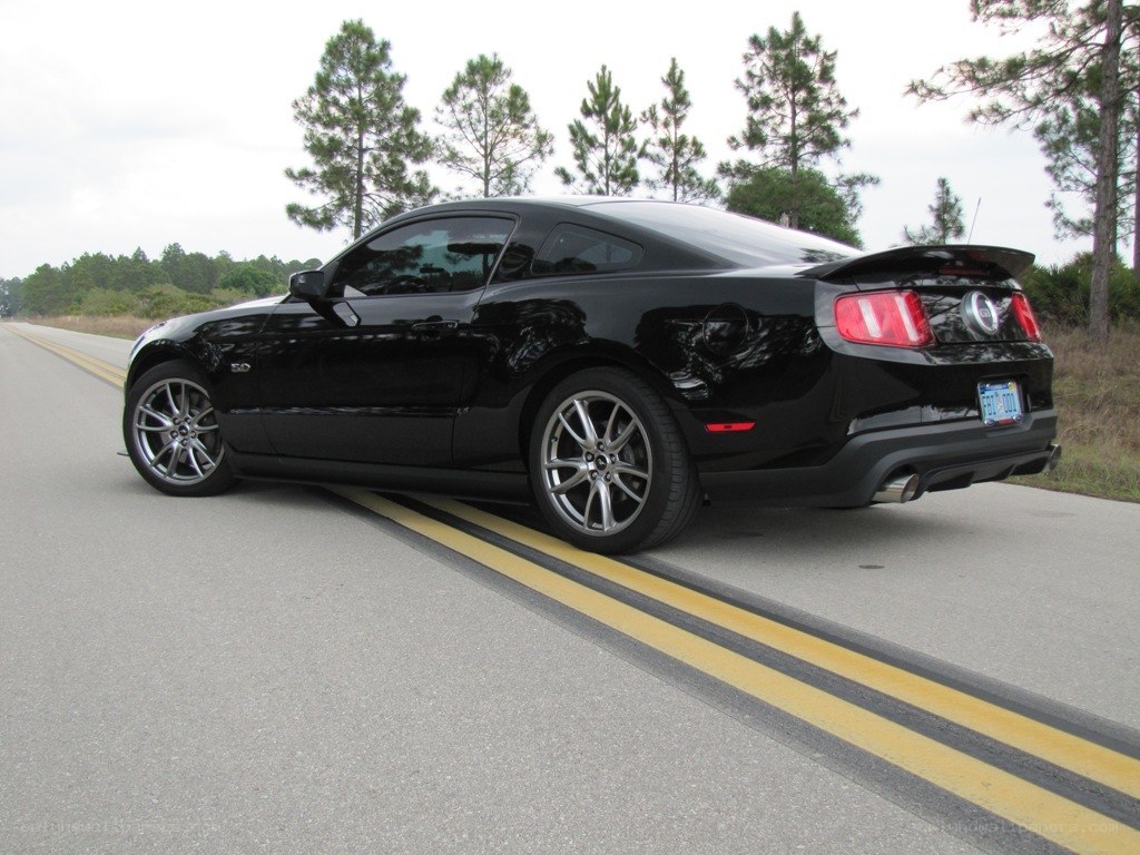 black mustang on road