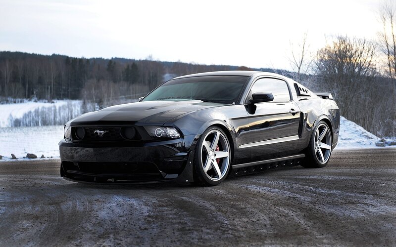 Black Mustang on Road — Dramatic, Winter
