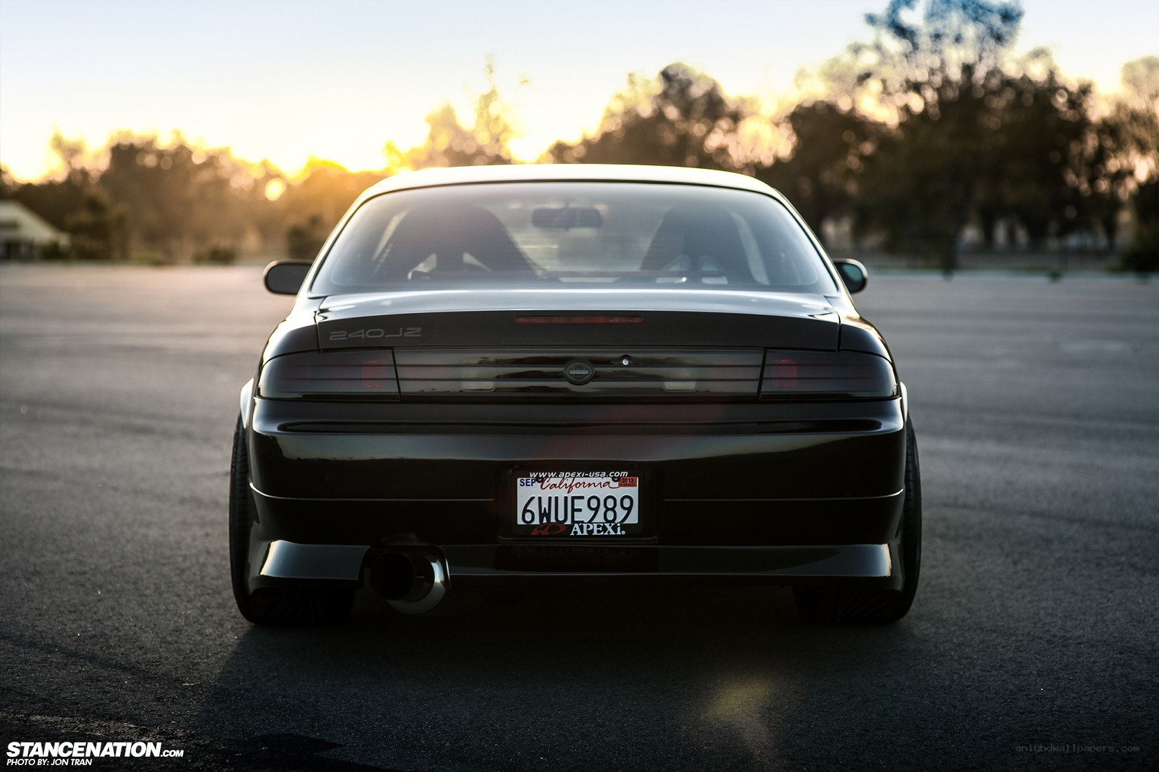 black nissan 240sx at sunset