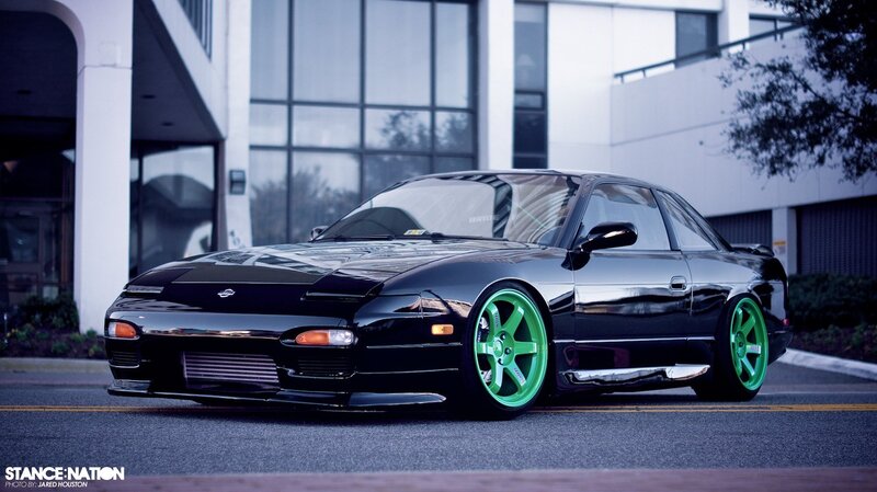 black nissan 240sx with green wheels