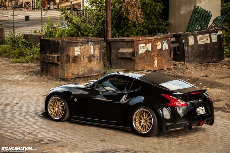 Black Nissan 370Z on cobblestones