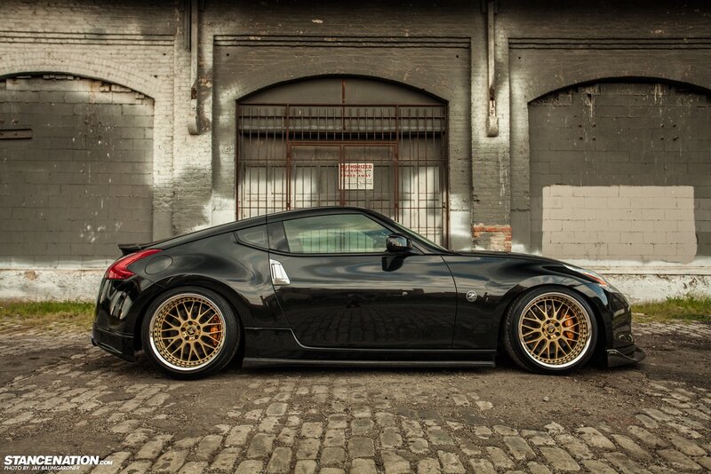Black Nissan 370Z with gold wheels