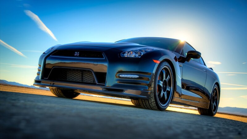 Black Nissan GT-R at sunset