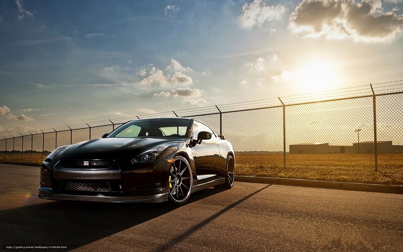 Black Nissan GT-R at sunset