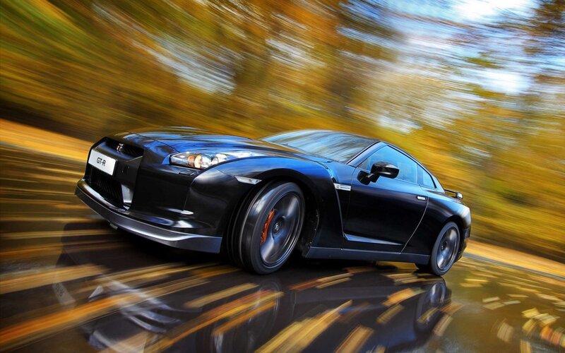 Black Nissan GT-R in motion