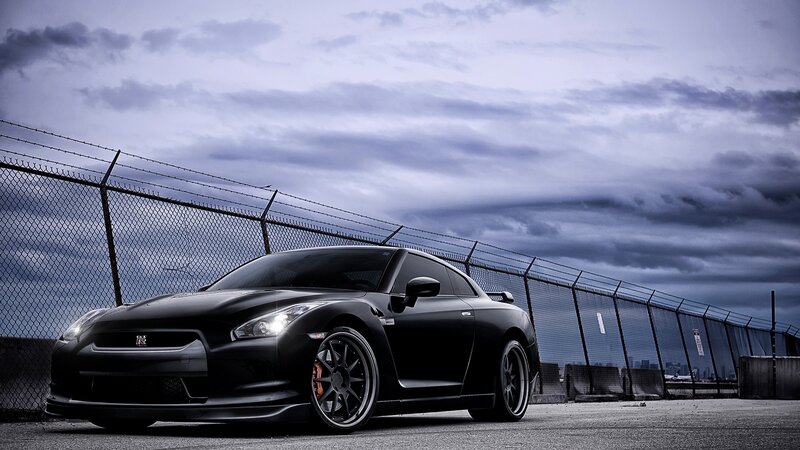 black nissan gt-r on a cloudy day