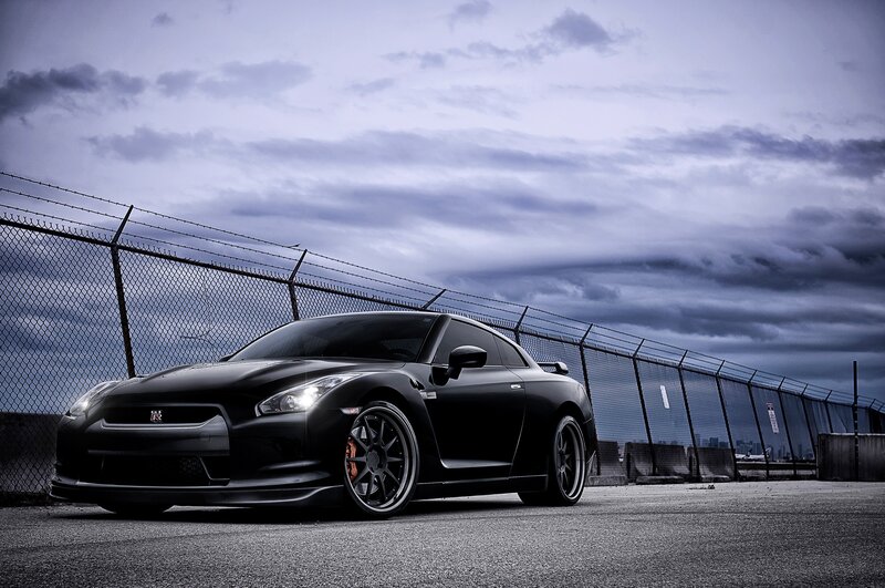 Black Nissan GT-R on a cloudy day