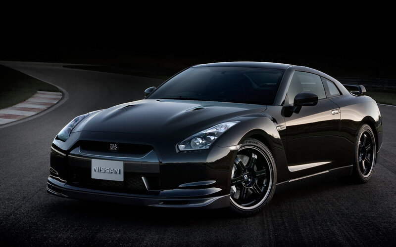 Black Nissan GT-R on a racetrack