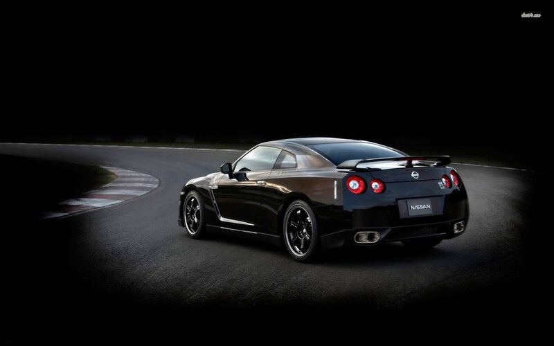 Black Nissan GT-R on a racetrack