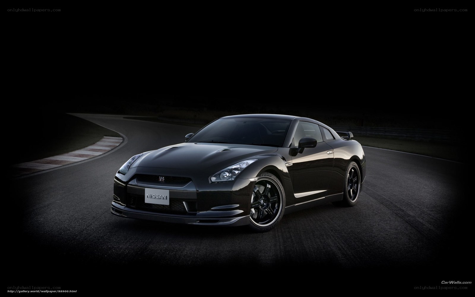 Black Nissan GT-R on a racetrack