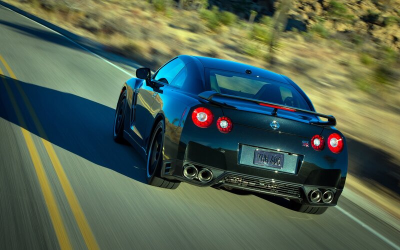 Black Nissan GT-R on a winding road