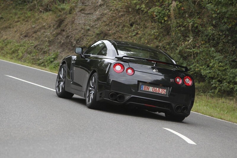 black nissan gt-r on a winding road