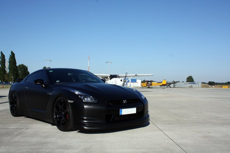Black Nissan GT-R on airfield