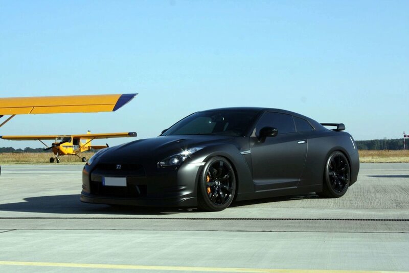 Black Nissan GT-R on airfield