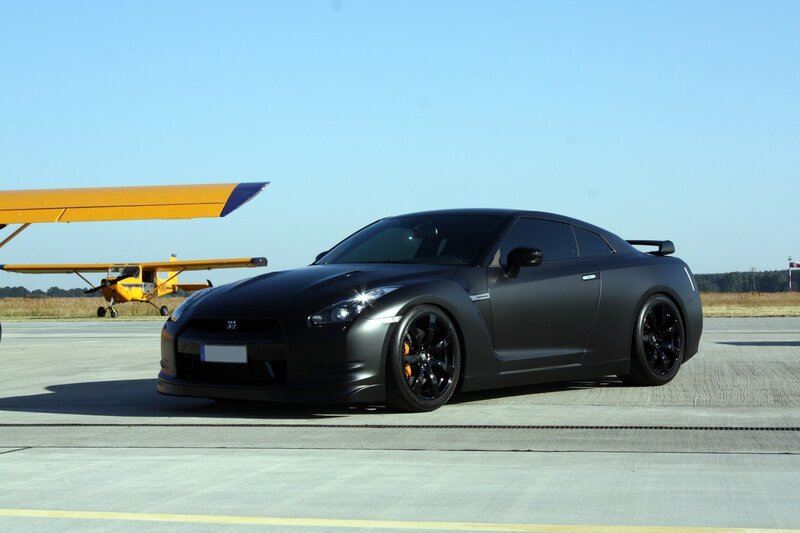 Black Nissan GT-R on airfield