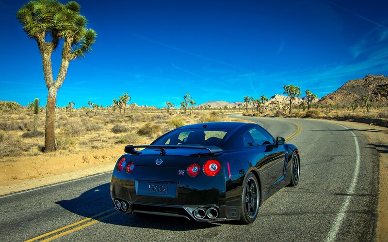 Black Nissan GT-R on desert road