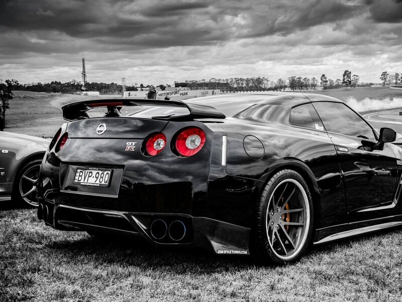 Black Nissan GT-R on grass