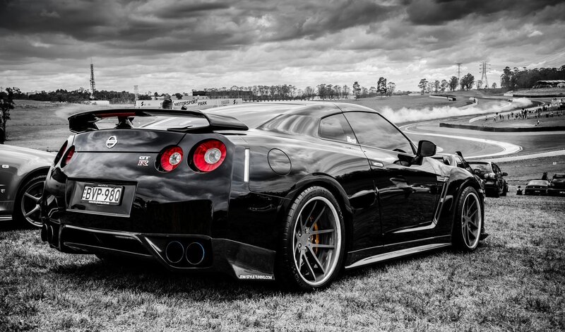 Black Nissan GT-R on grass