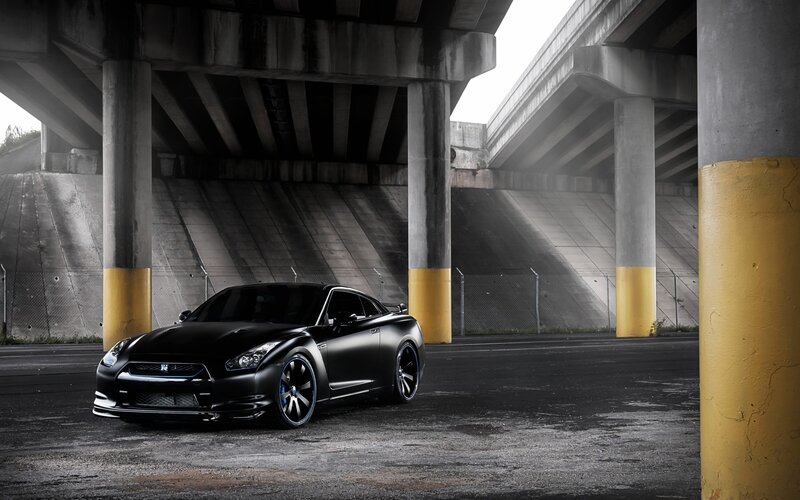 Black Nissan GT-R under highway