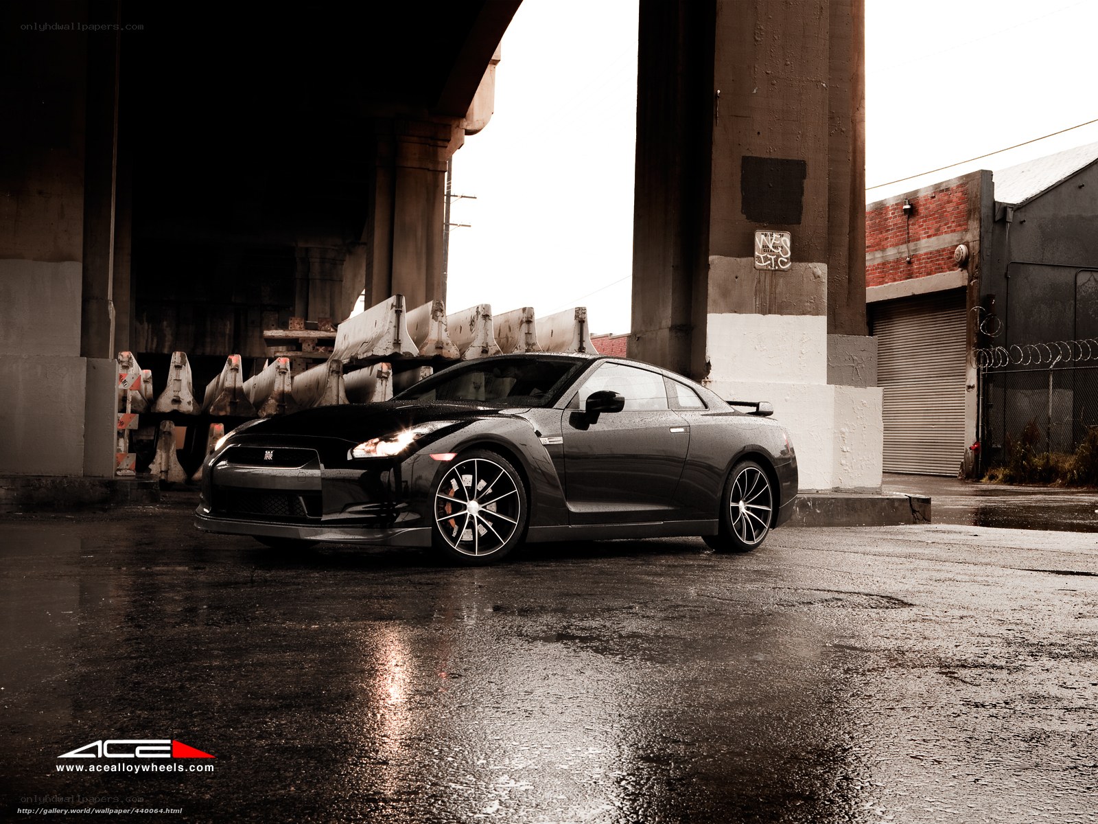 Black Nissan GT-R under overpass
