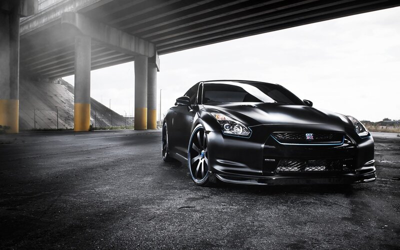 Black Nissan GT-R under overpass