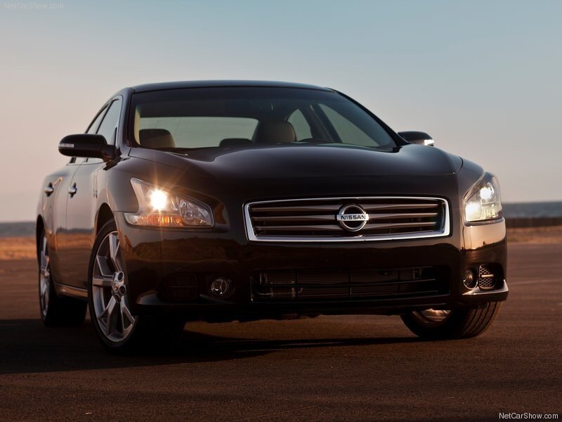 Black Nissan Maxima at sunset
