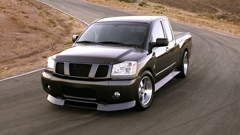 black nissan pickup truck on road
