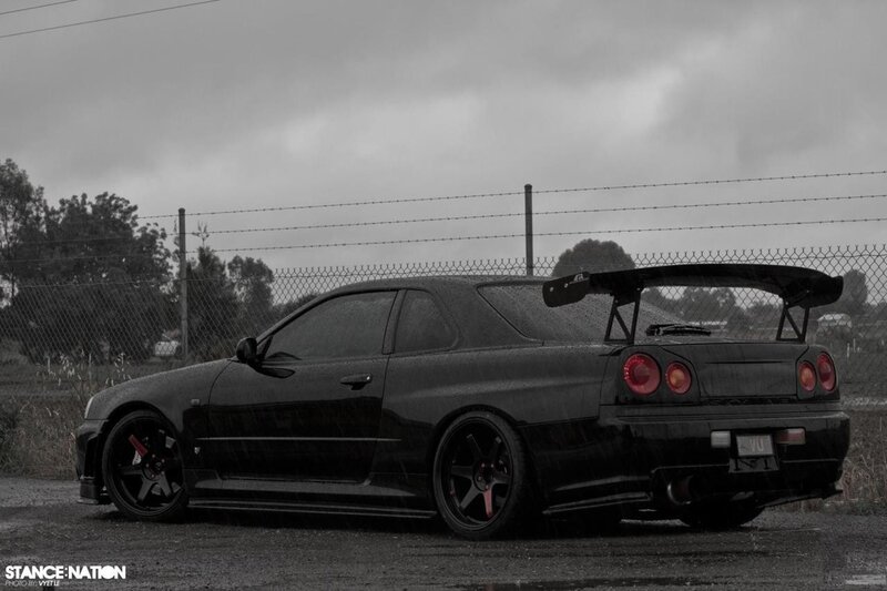 black nissan skyline in rain