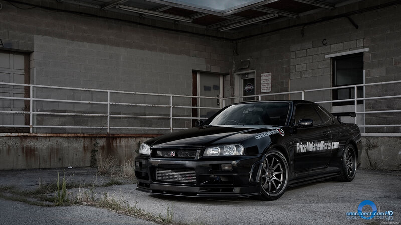 black nissan skyline parked in garage