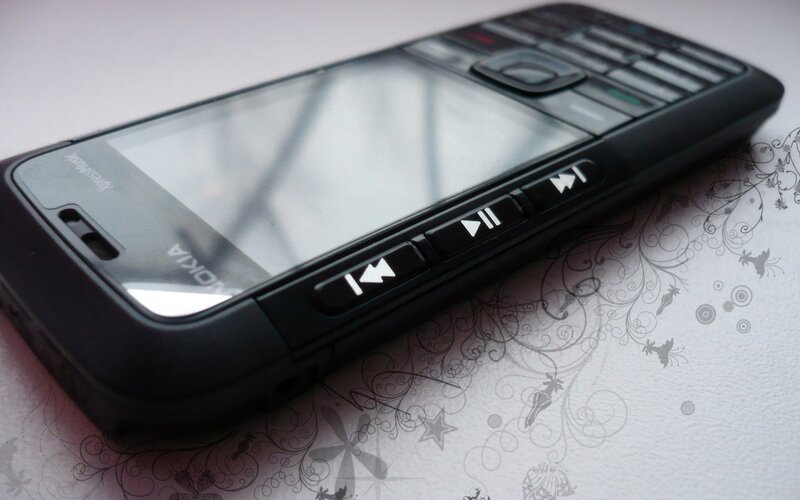 black nokia phone on patterned surface