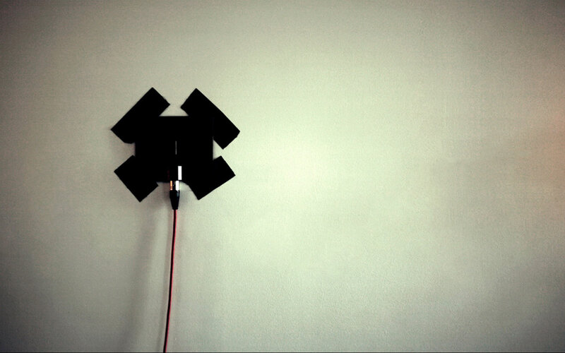 black object on white wall