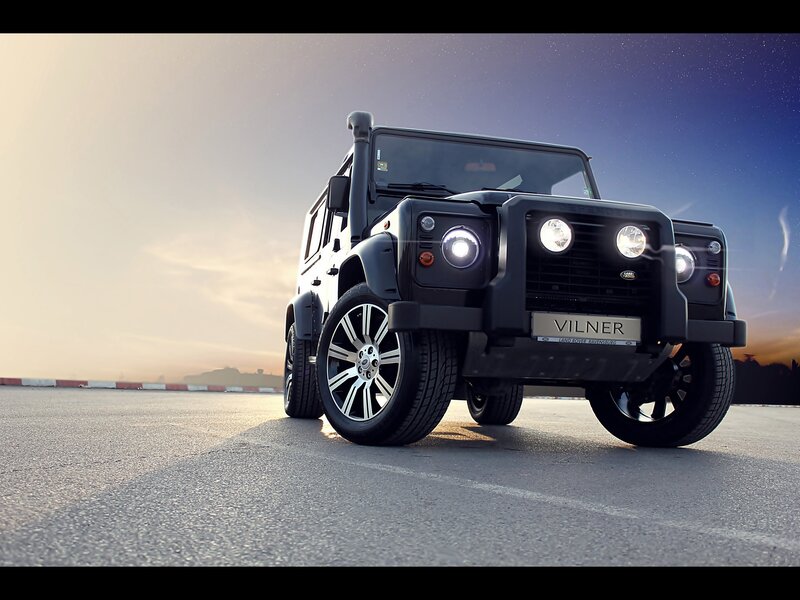 Black off-road vehicle at sunset